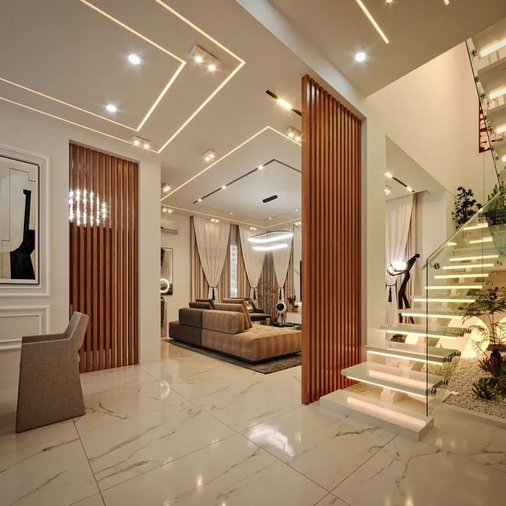 Villa interior with a feature staircase, wooden slat partition and marble flooring