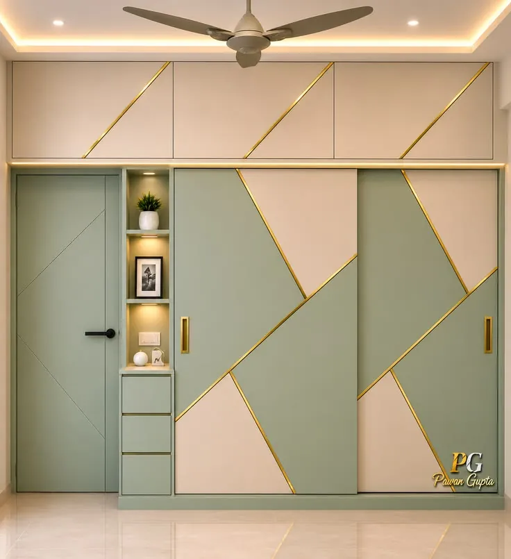 Sliding wardrobe with geometric panels in soft sage green and blush pink with gold trim